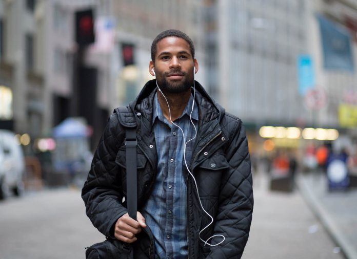 man-walking-down-street-jaywalker