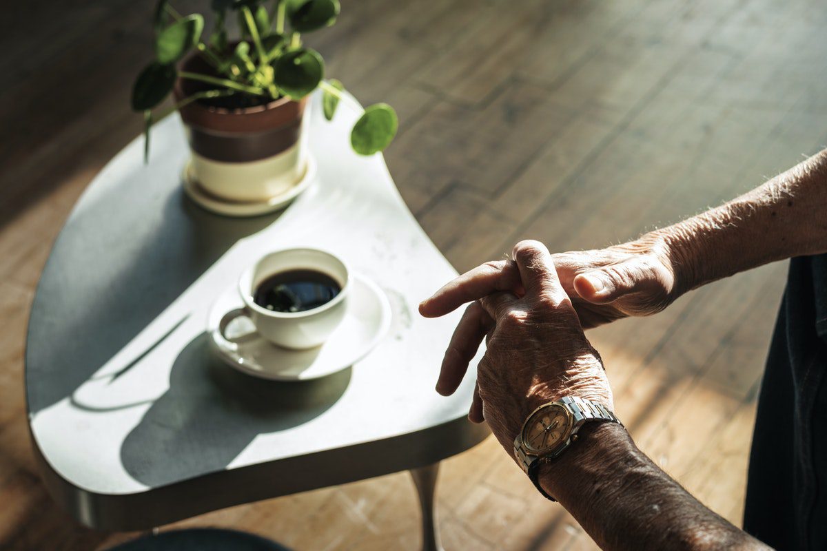 man-sitting-with-coffee-jaywalkerlodge