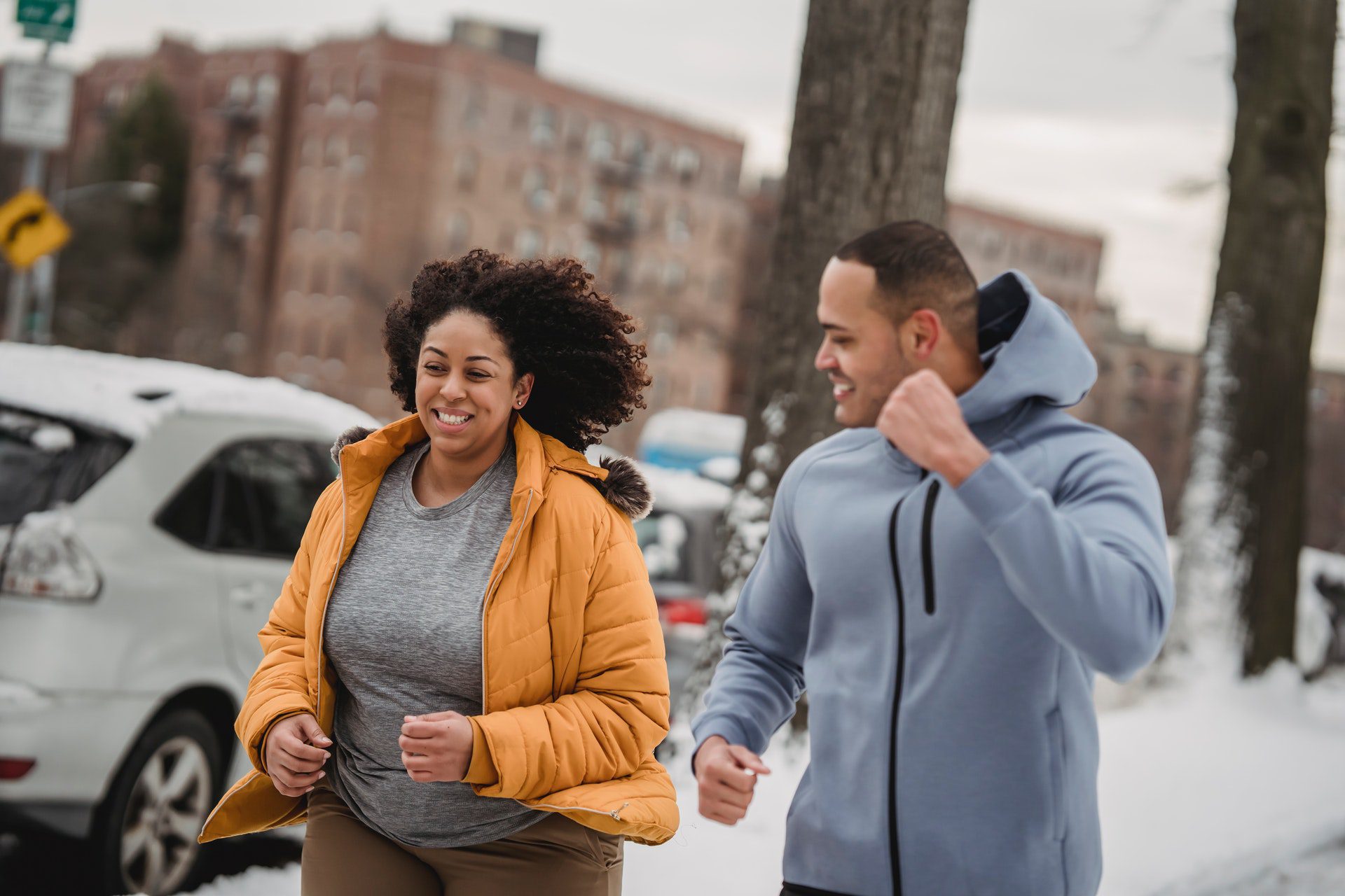 A couple running during winter