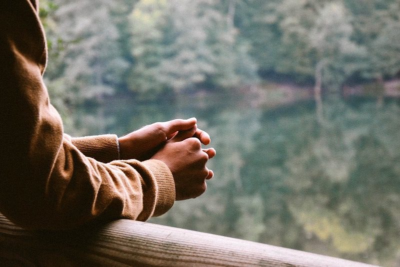 A man in recovery contemplates his addiction triggers.