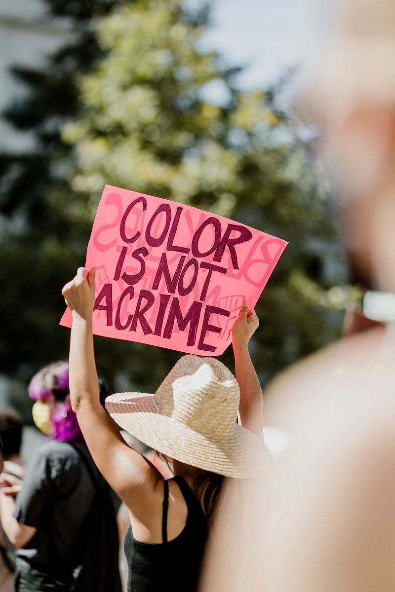 An advocate for people of color seeking addiction and mental health services at a protest.